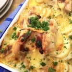One pan swiss chicken with creamy potato - chicken thighs stuffed with ham & cheese on a bed of sliced potato & cream sauce