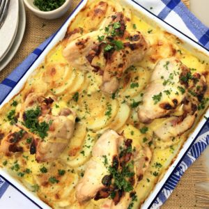 One pan swiss chicken with creamy potato - chicken thighs stufffed with ham & cheese on a bed of sliced potato & creamy sauce