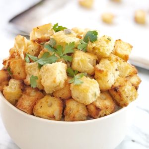 golden cubes of crunchy bread in a white bowl