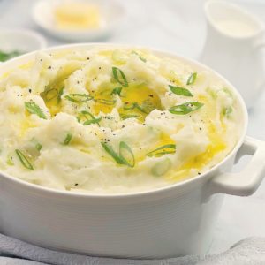 irish champ potatoes - creamy mashed potatoes with green onions scallions and lashings of melted butter