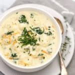 creamy thick chicken and vegetable soup in white bowl