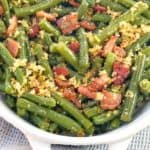 green beans and bacon in a white dish