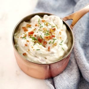 mayonnaise in small pot on a white board