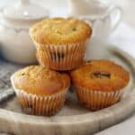 Muffins sitting on a marble tray.